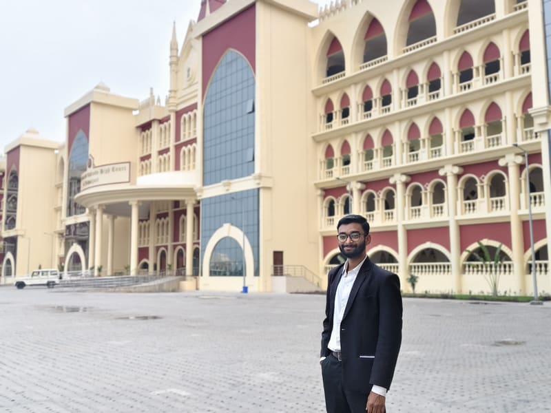Satyajit Paul in a suit on the forecourt of the Circuit Bench of Calcutta High Court at Jalpaiguri